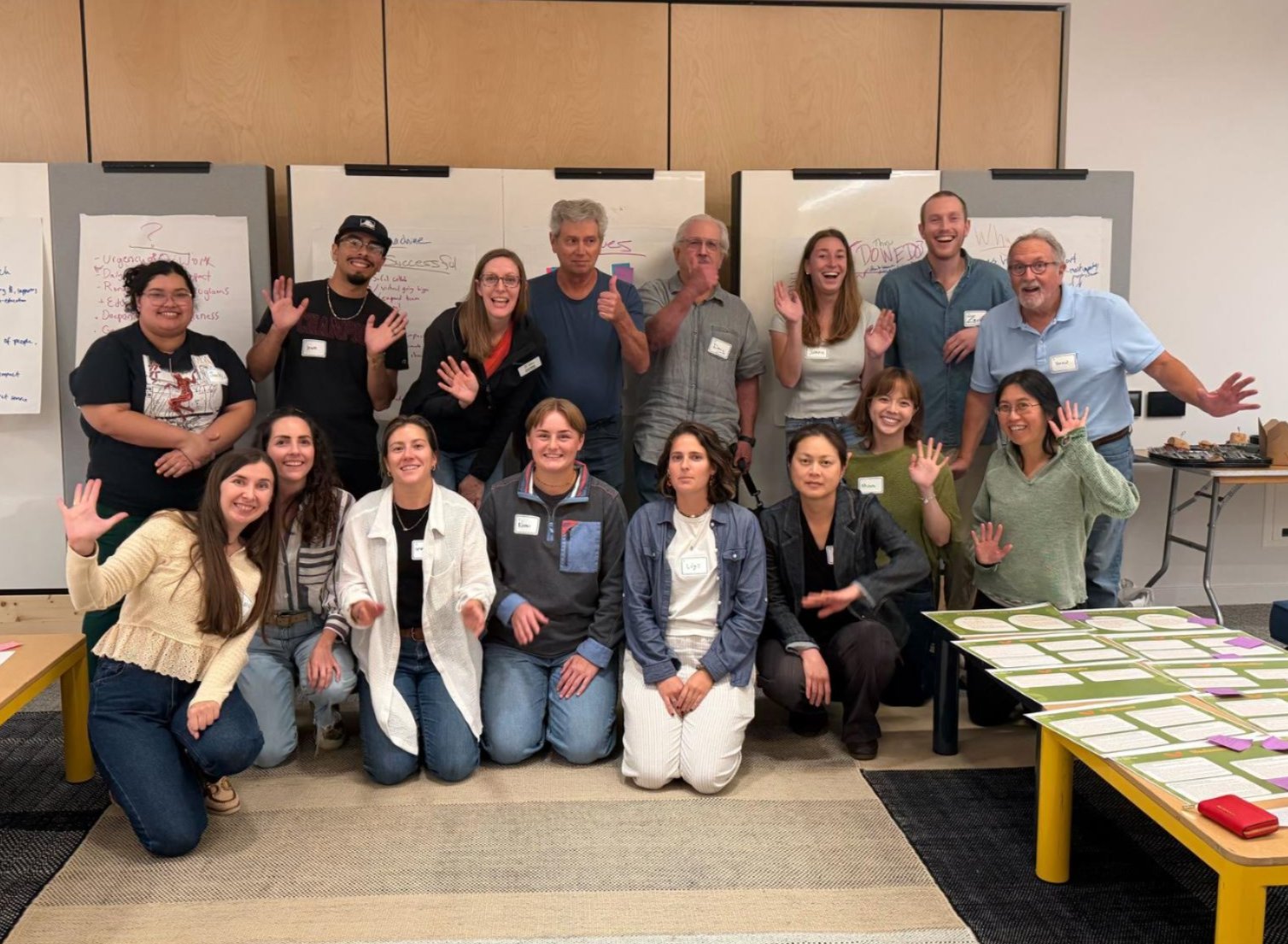 Two rows of people pose for a group photo