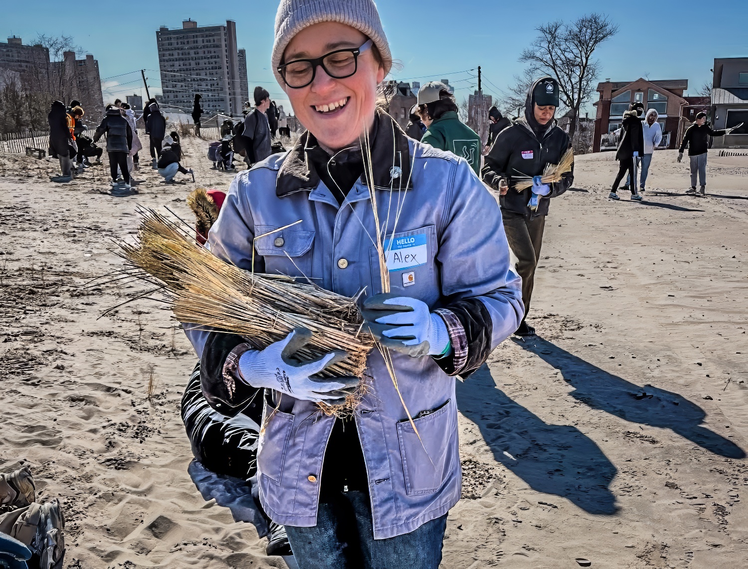 Littoral Society NE Chapter Director Alexandra Kanonik with high school students planting beach grass at Coney Island Creek Park