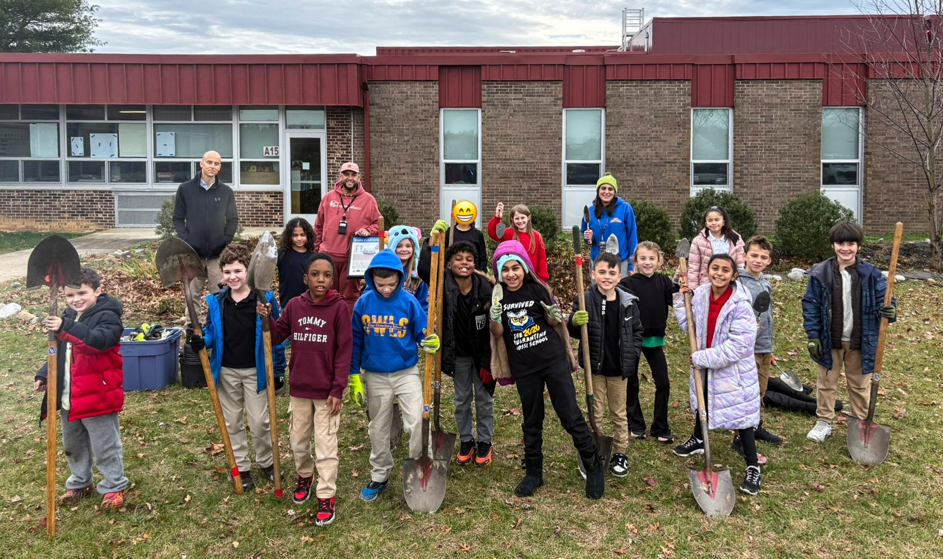 students from Rossi Elementary School in Vineland, NJ planting the rain garden