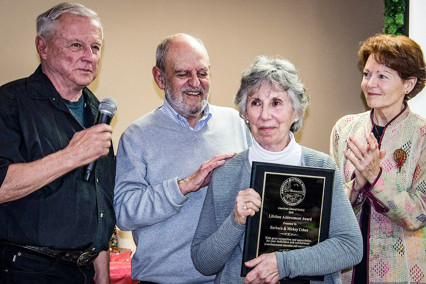 Barbara Cohen (center, holding plaque) and her husband Mickey receive the American Littoral Society Lifetime Achievement Award from NE Chapter Director Don Riepe (L) and Kathleen Gasienica, former president of the Littoral Society Board of Trustees.