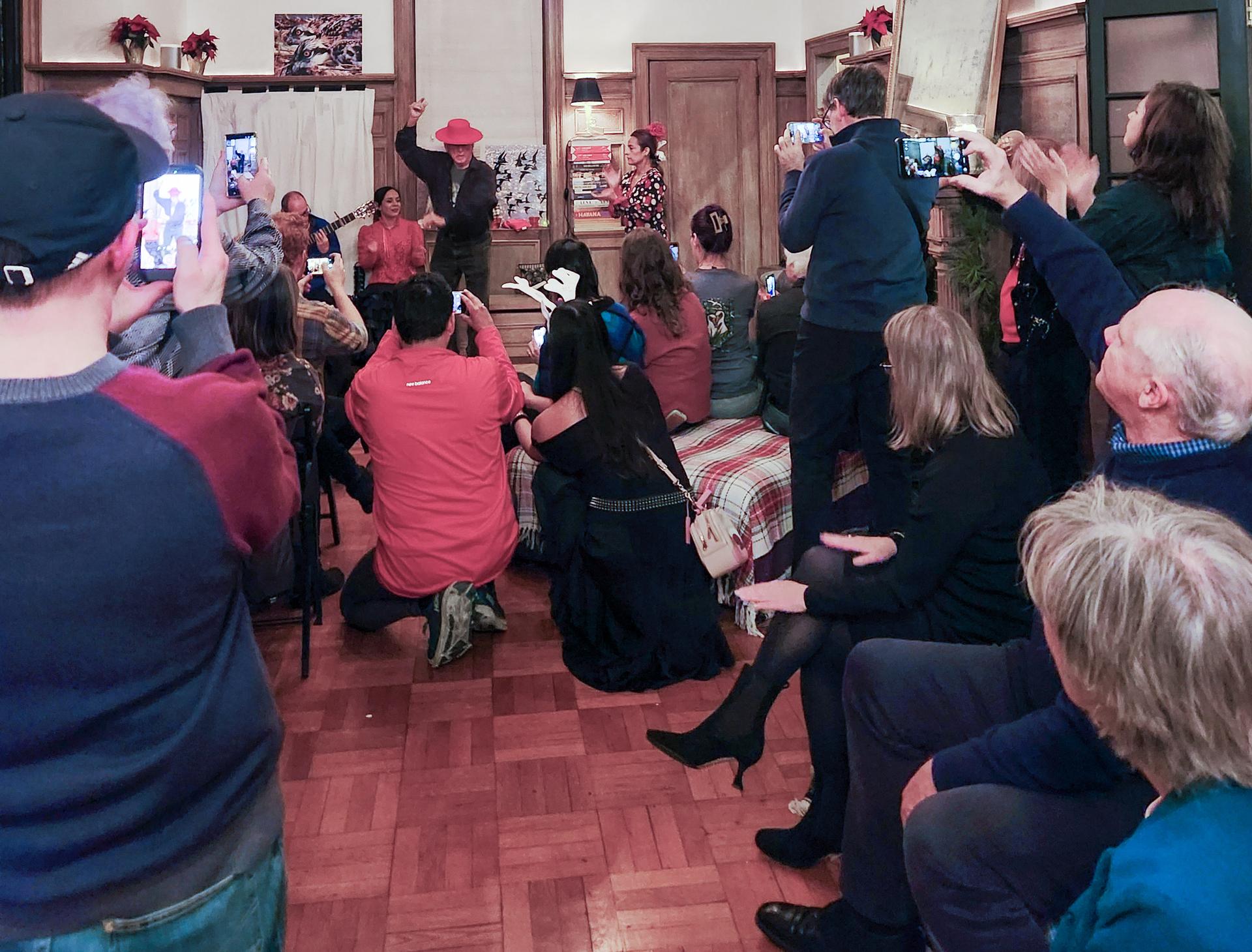 Attendees at the Littoral Society's NE Chapter holiday pary watch Don Diego flamenco dancing