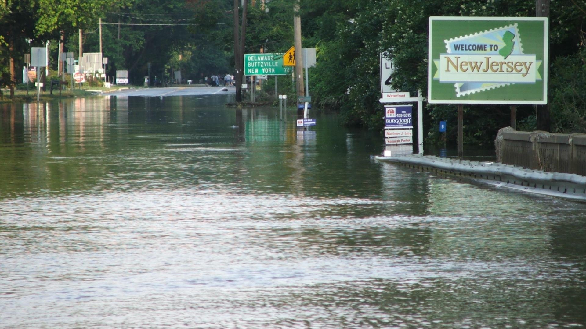 New Jersey highway sign over flooded roadway