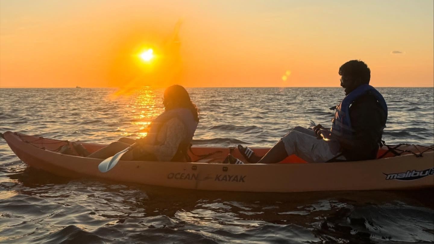 two people in kayak at sunset on Sandy Hook Bay