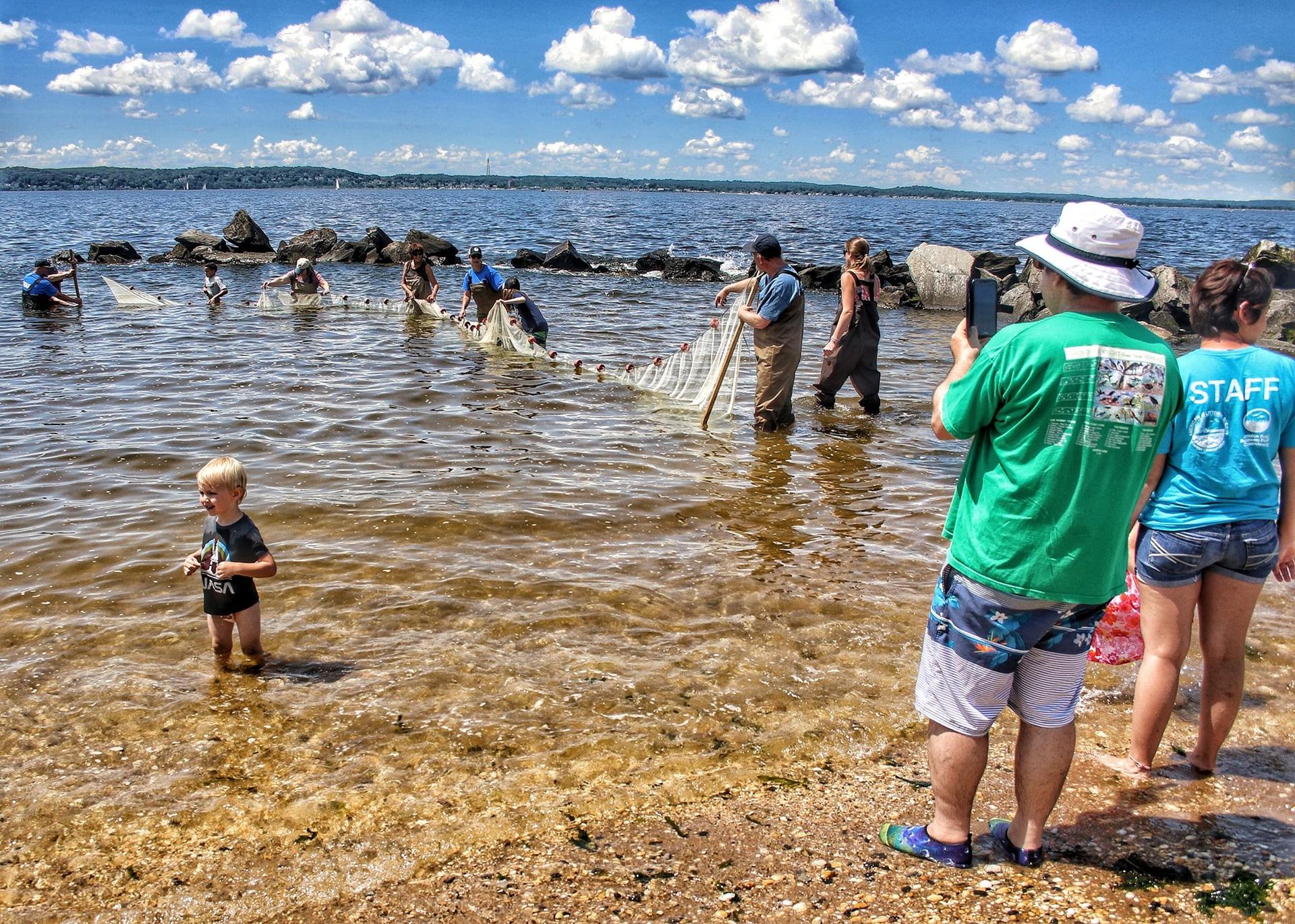families sein in sandy hook bay as part of littoral society members day