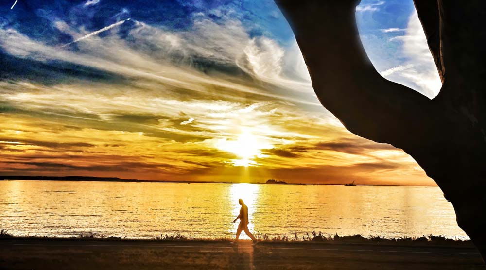 man walking on Sandy Hook