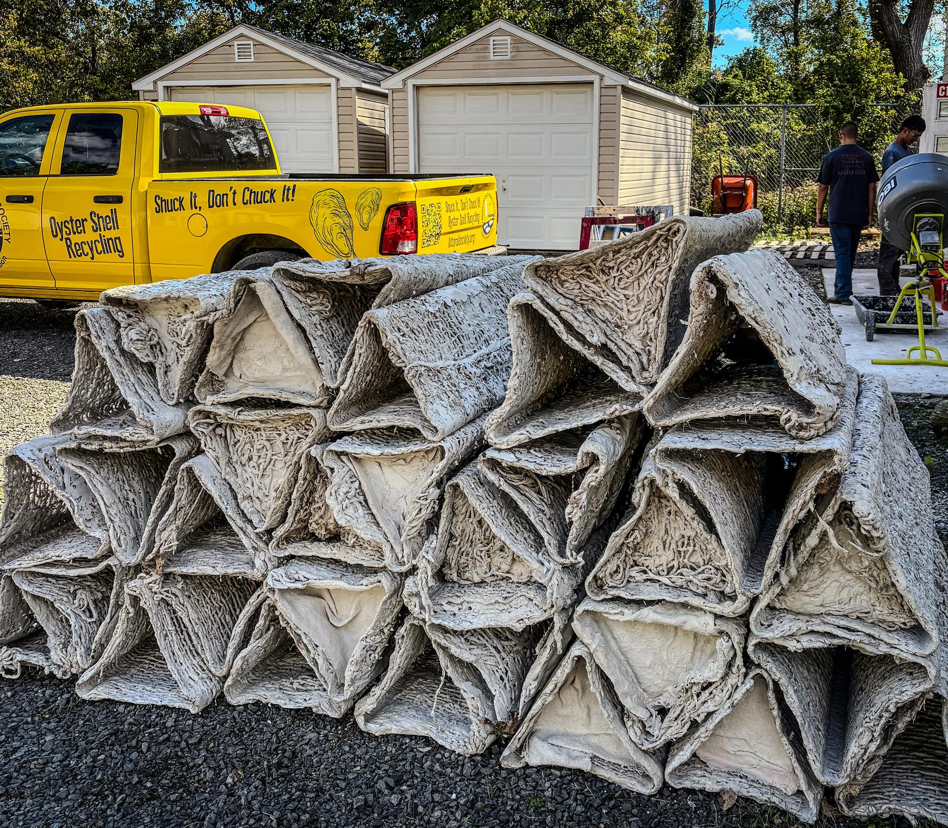 Reef prisms stacked outside workshop