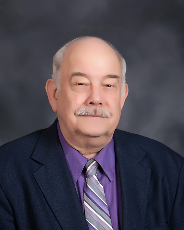 Man in suit smiling