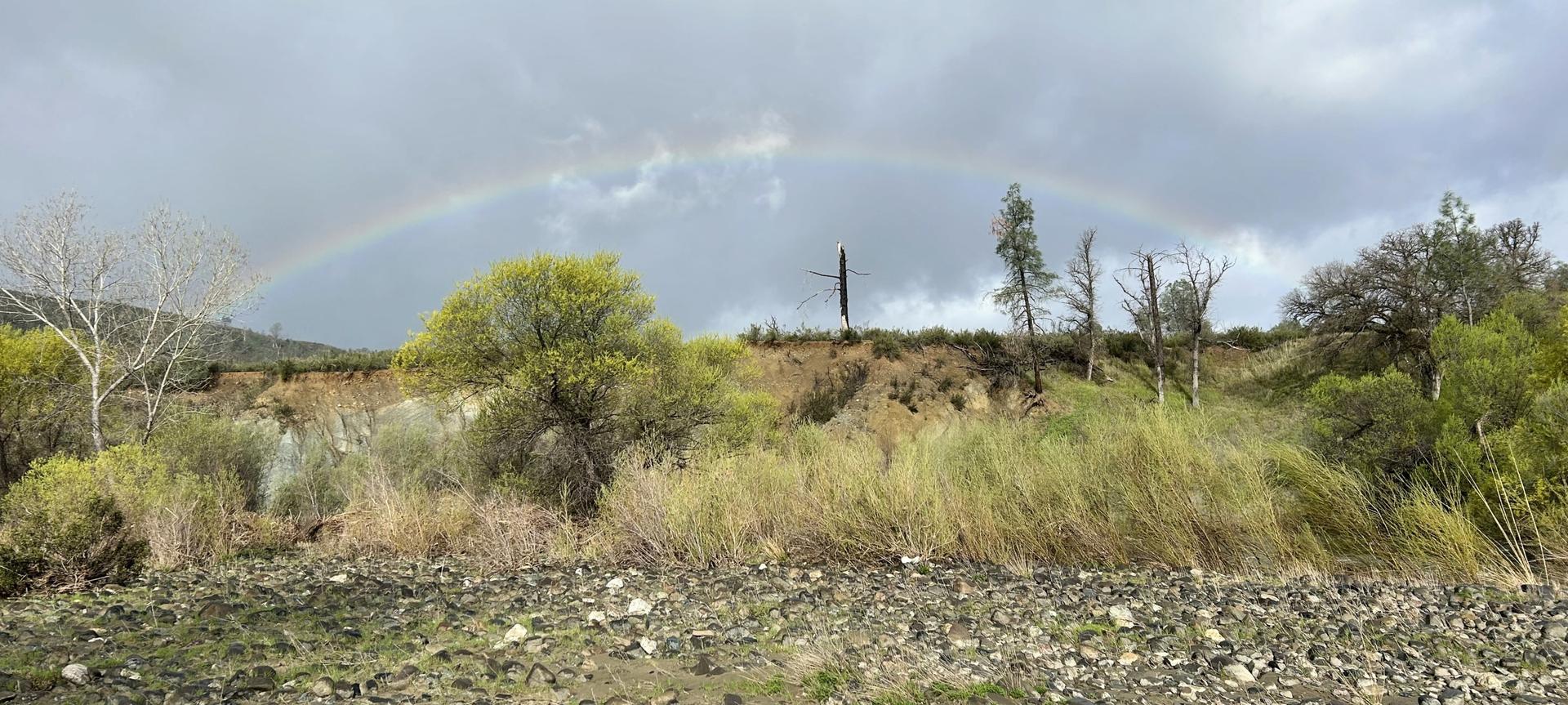 rainbow over grasslands