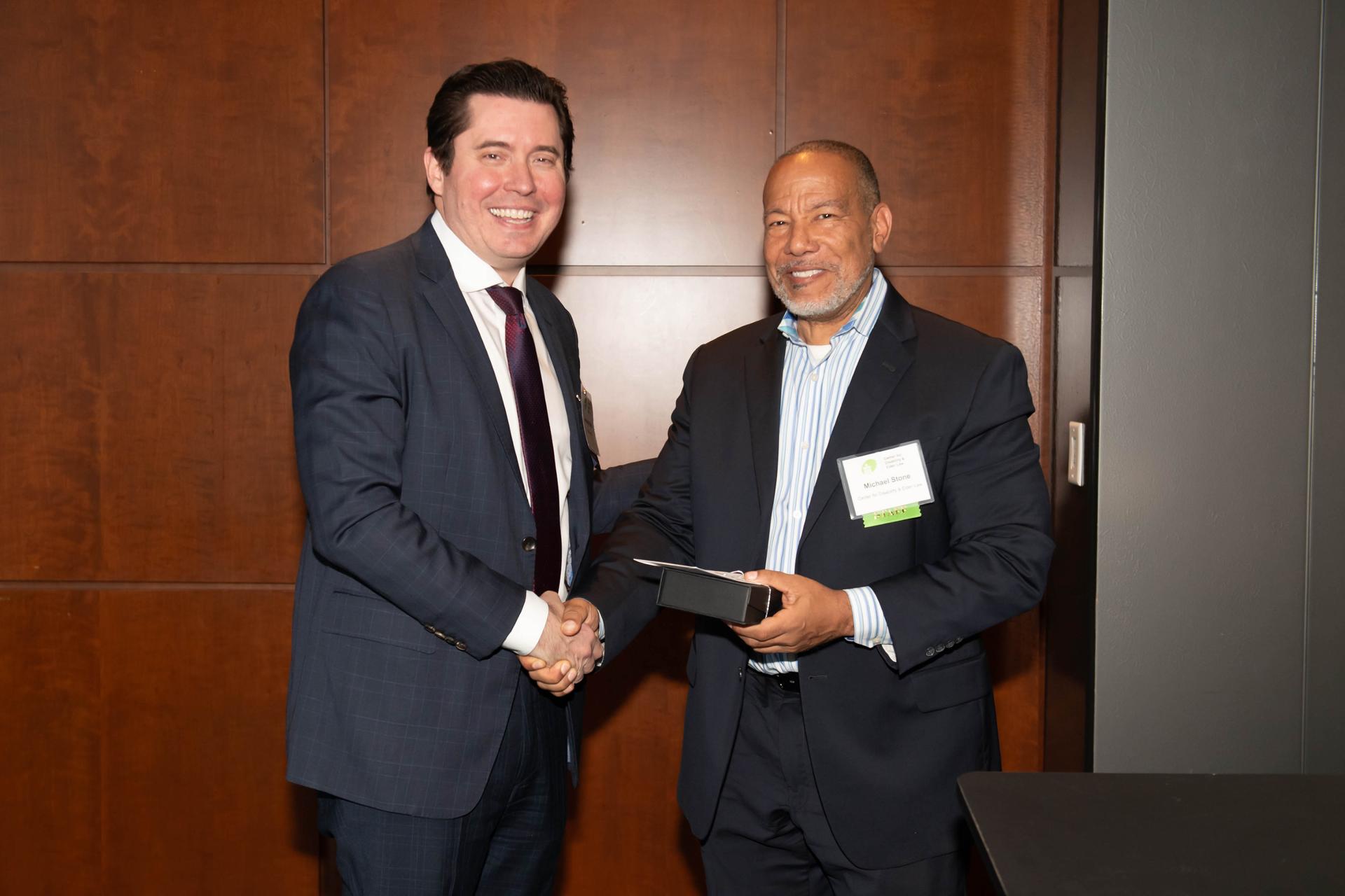 CDEL ImmediateOut going board member Anthony O'Neill receiving an award from CDEL Executive Director Michael Stone at CDEL's 6/11 Appreciation Event
