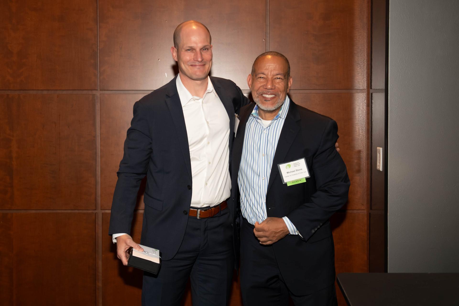 CDEL Immediate Past President Russ Molter receiving an award from CDEL Executive Director Michael Stone at CDEL's 6/11 Appreciation Event