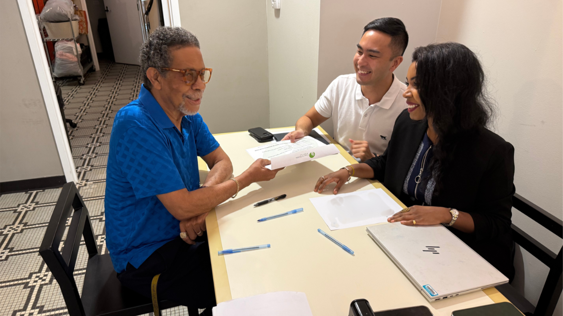 CDEL volunteers working with a client at CDEL’s May 18th POA workshop at the Center on Cottage Grove