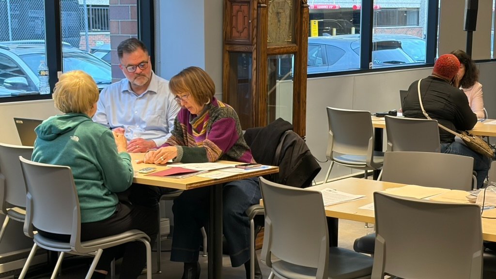 A CDEL client with volunteers at CDEL's POA Workshop at The Chicago Lighthouse