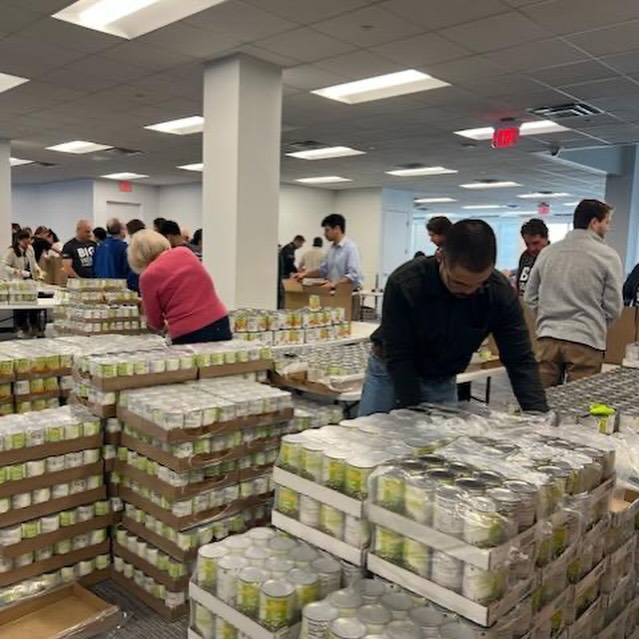 Canned goods being organized by volunteers