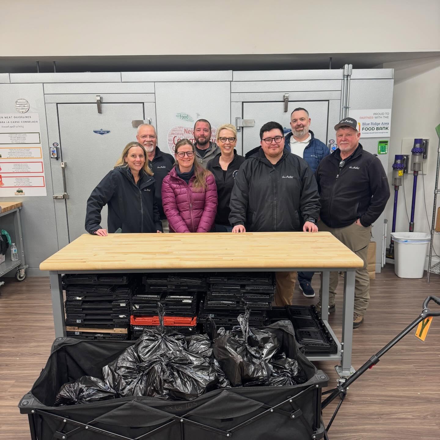 Van Metre volunteers posing with donations in front of the Pantry freezer