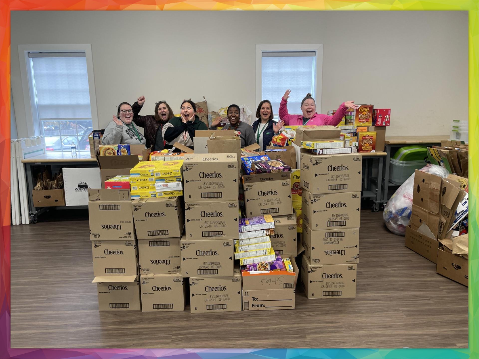 People standing behind towers of cereal boxes