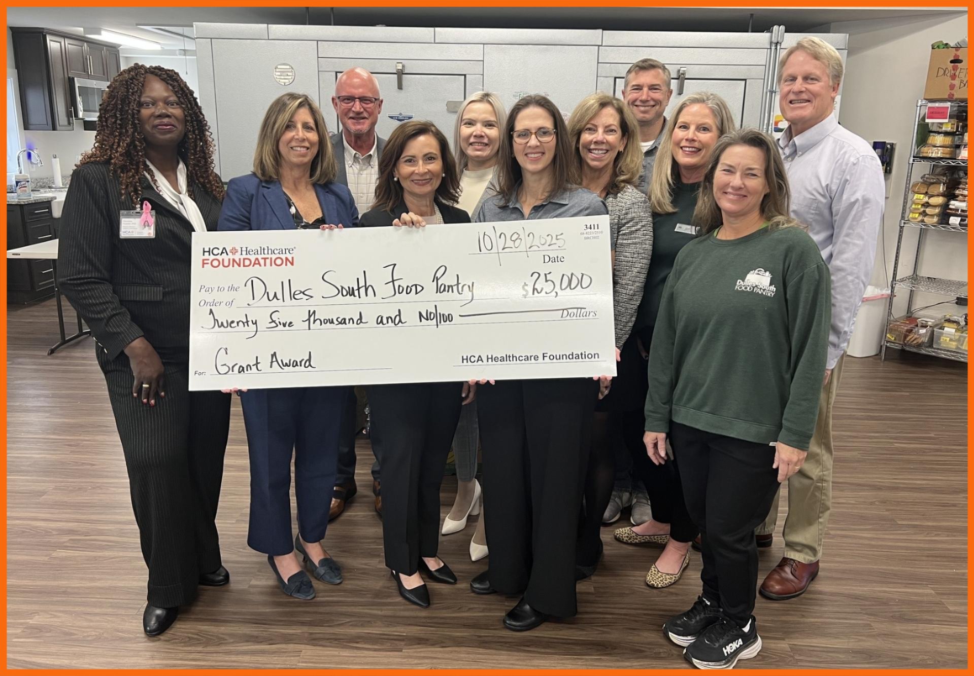 Group of people holding ceremonial check