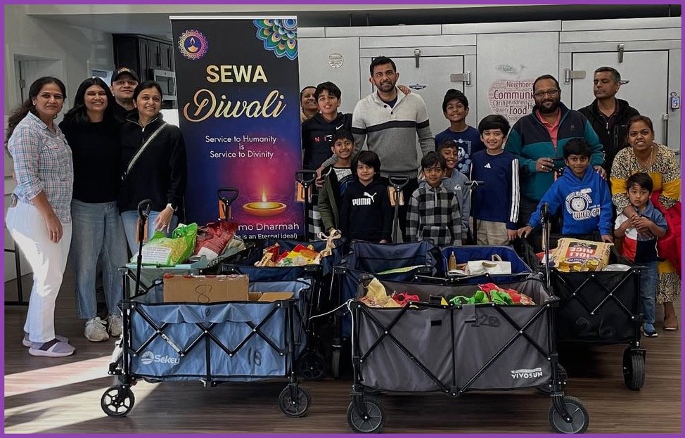 People standing behind wagons filled with food donations