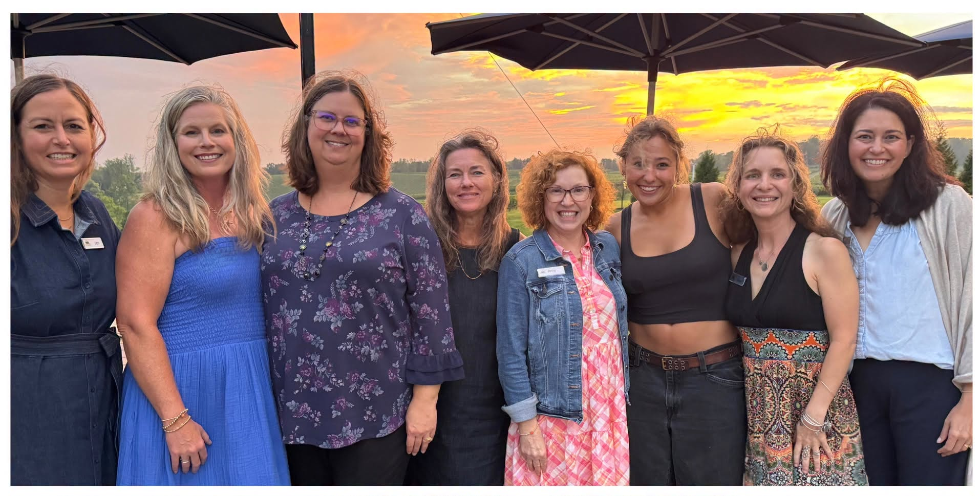 DSFP staff members posing for a photo at sunset outside at event