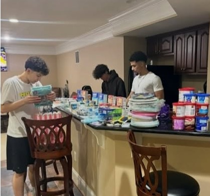 Three students assembling Birthday Bags