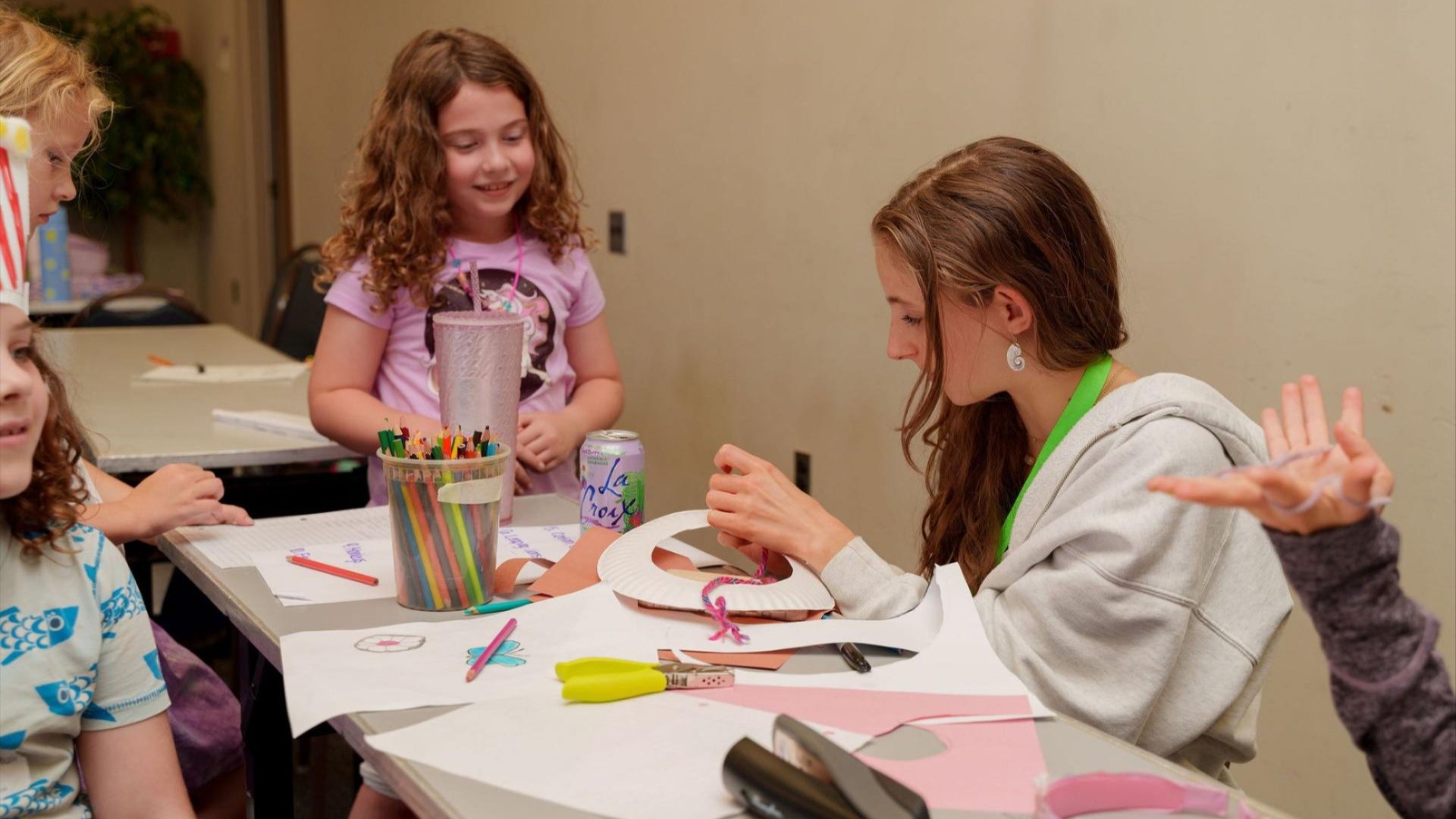 Third Friday reception featuring two individuals, one is audio describing artwork to another. Photo by Jen Scheib/
