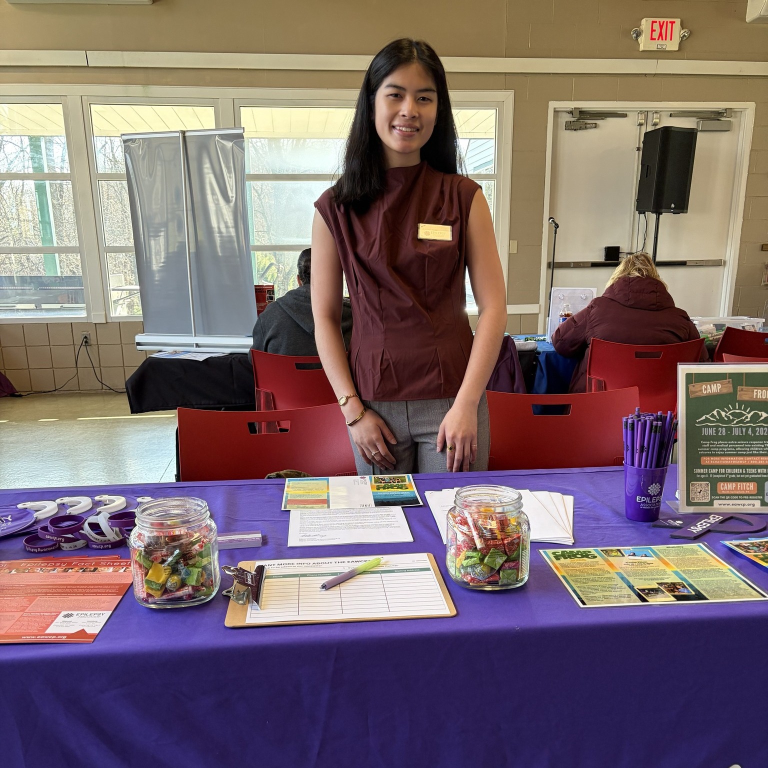 Rebecca standing at information table