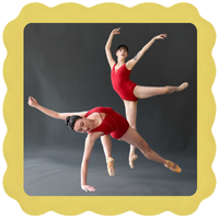 Two ballet dancers in red leotards perform dynamic poses against a dark background, with one dancer balanced on one arm and the other gracefully extending her arms and leg. The image has a wavy yellow border.