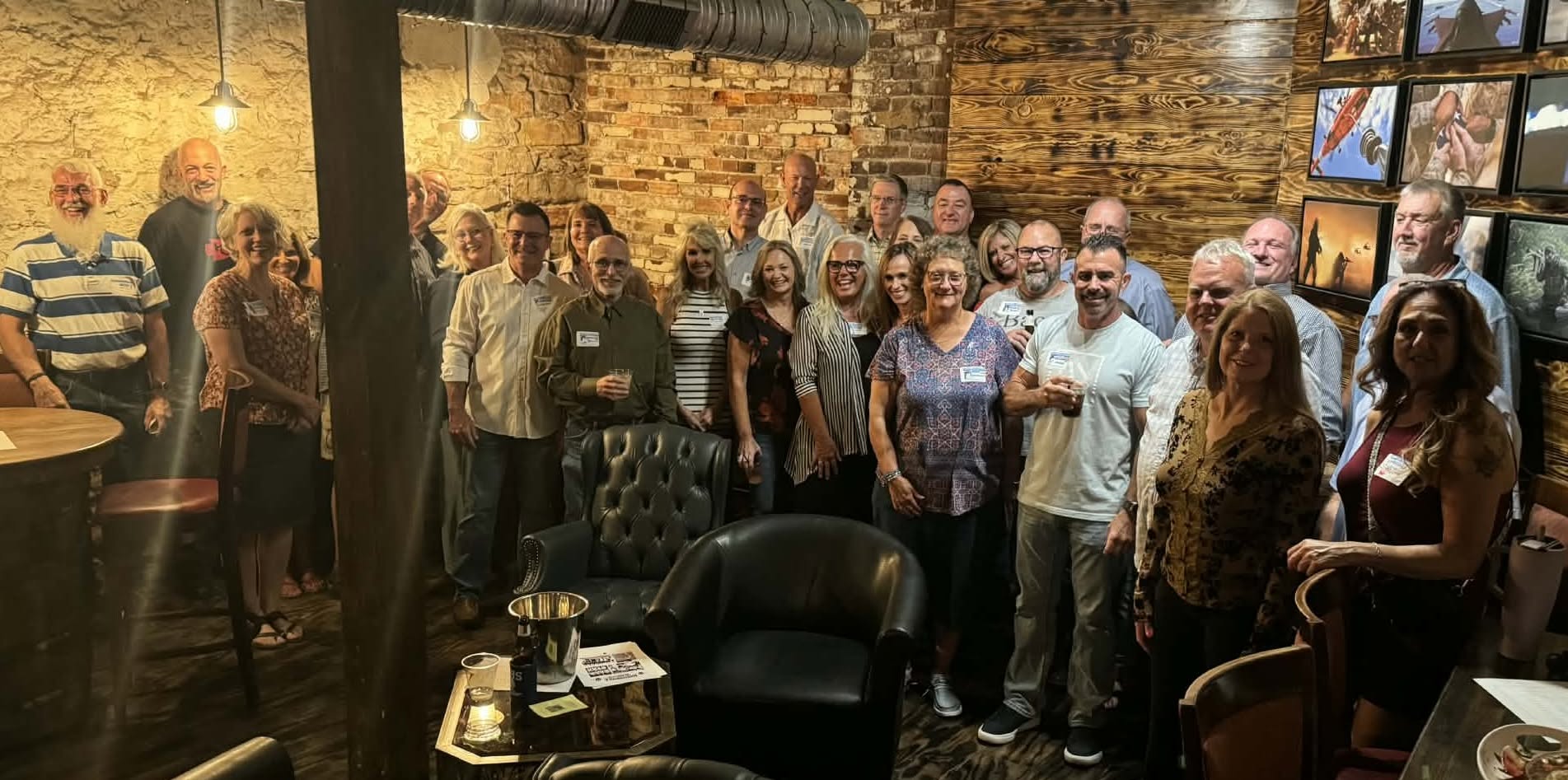 group photo of the class of 2016 at their 10-year reunion in a barn