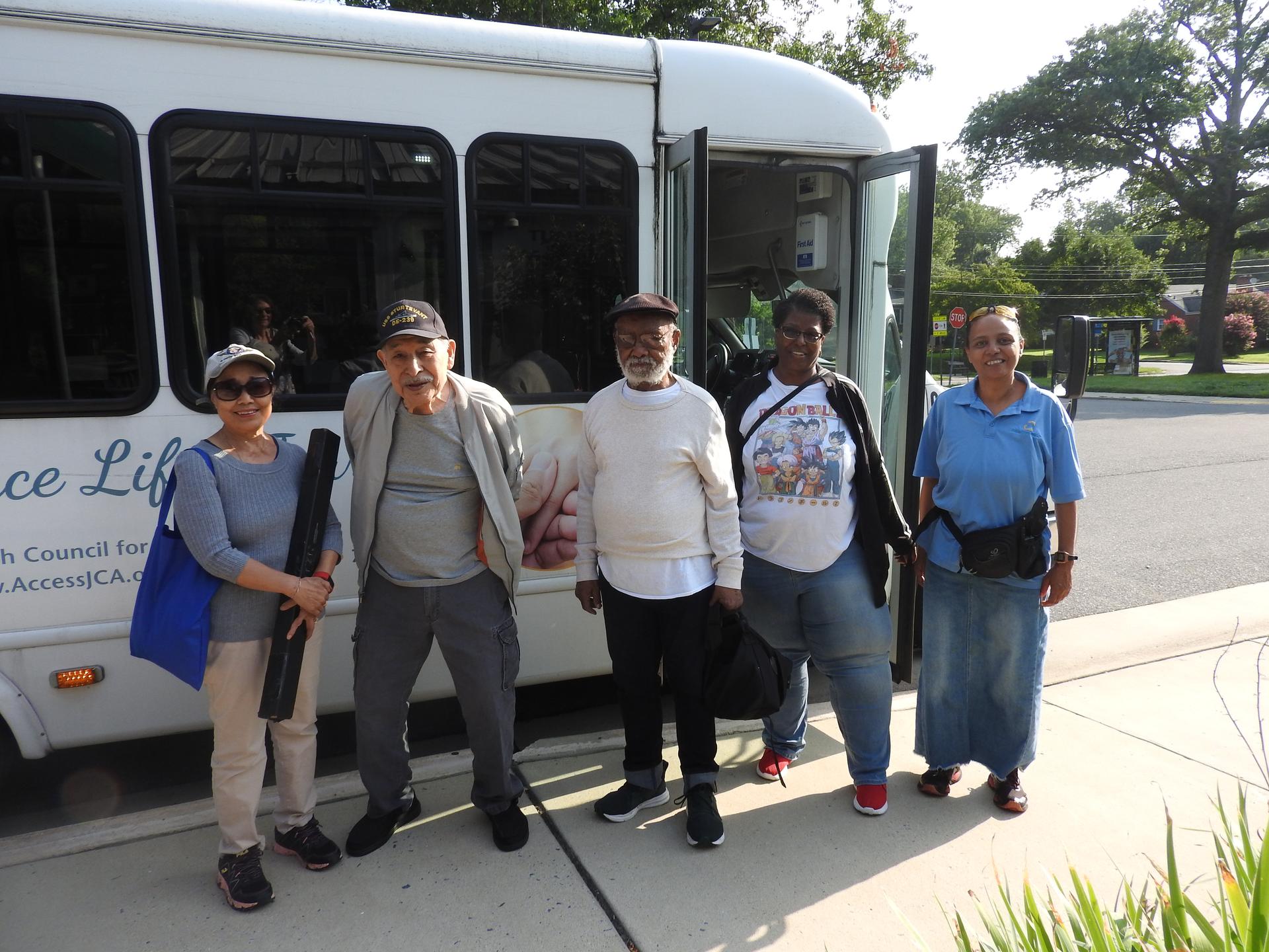 group of people and JCA bus