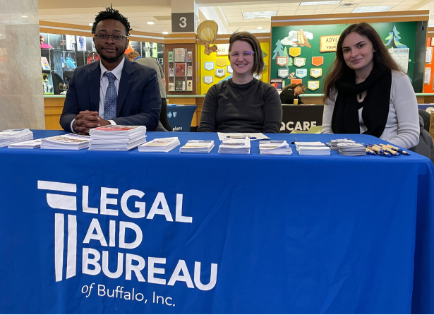 Photograph of Civil Legal Services staff, in the community, at a tabling event