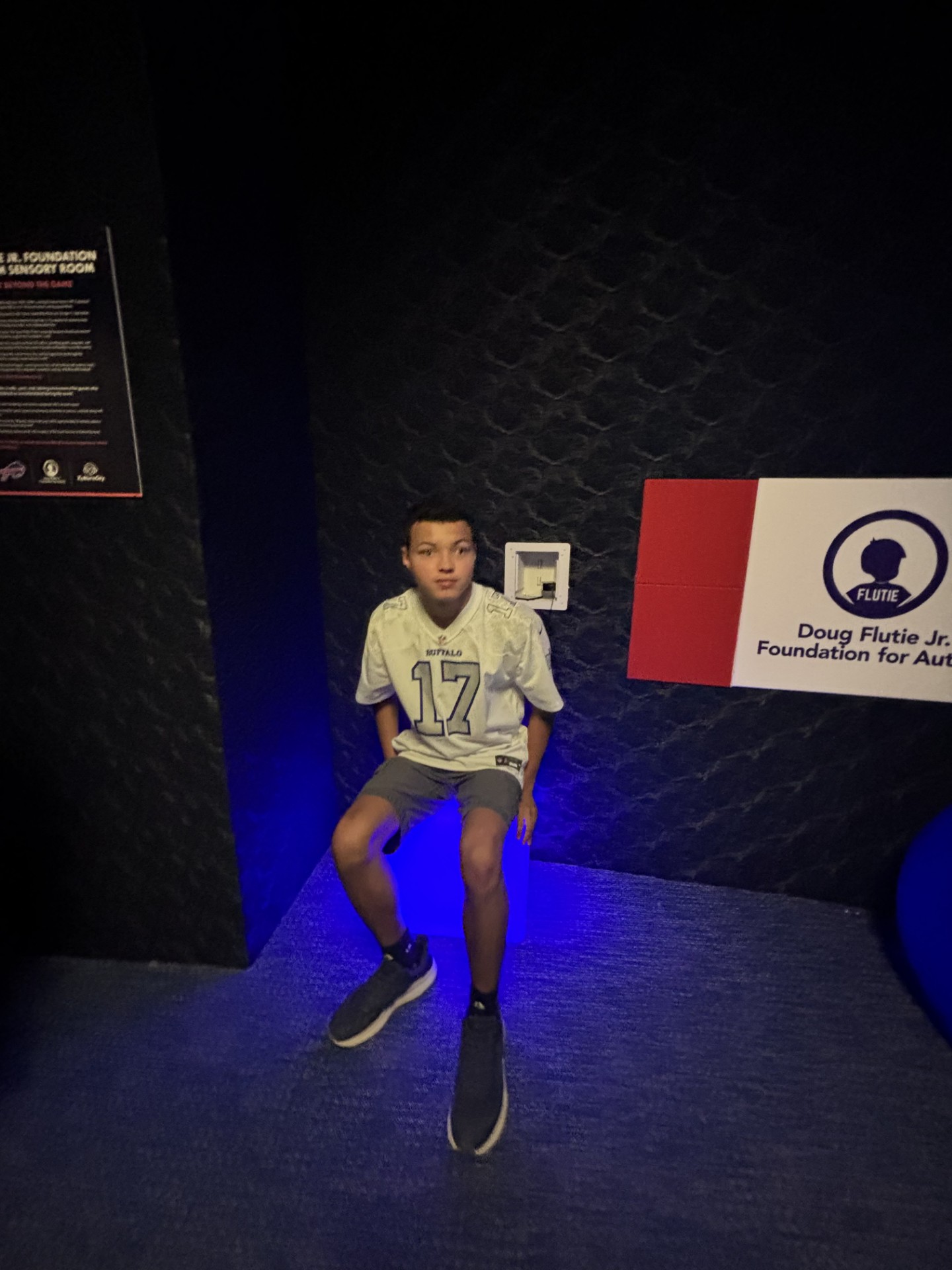 A boy sits in the sensory room at the new Highmark Stadium.