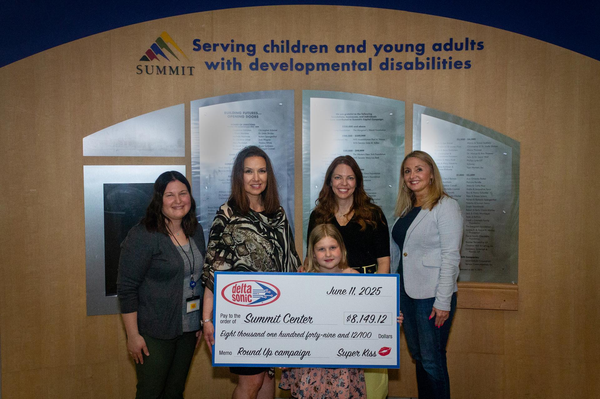 Pictured from left to right: Laura Brann, assistant development director, Lisa A. Foti, CEO of The Summit Center; Tammy Nicholson, Summit parent, and her daughter Charlotte; and Kim Allen, marketing director at Delta Sonic. 