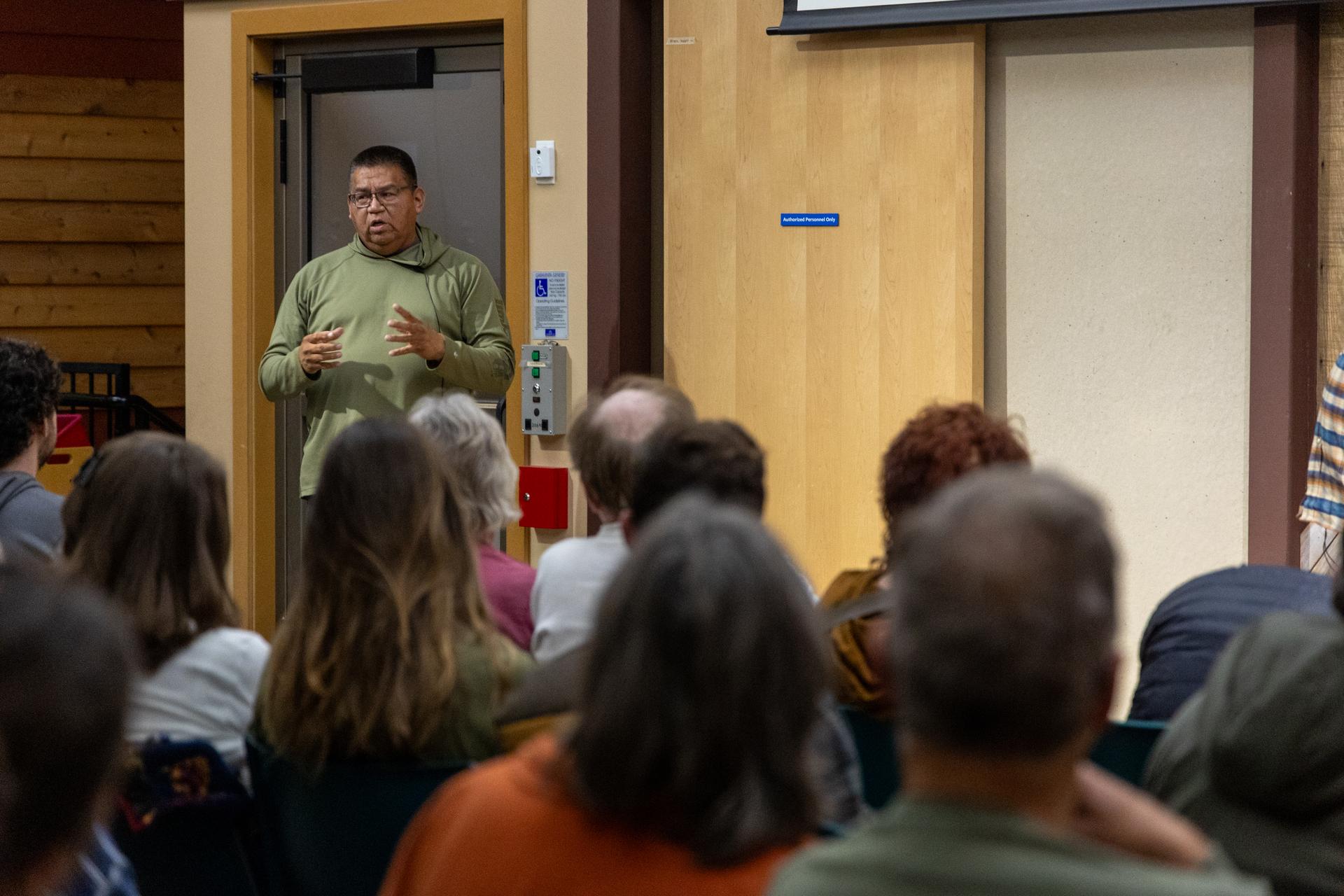 An image of Darnelle Sam at the Q&A session of the Red Barn: 'Fish War' film screening event.