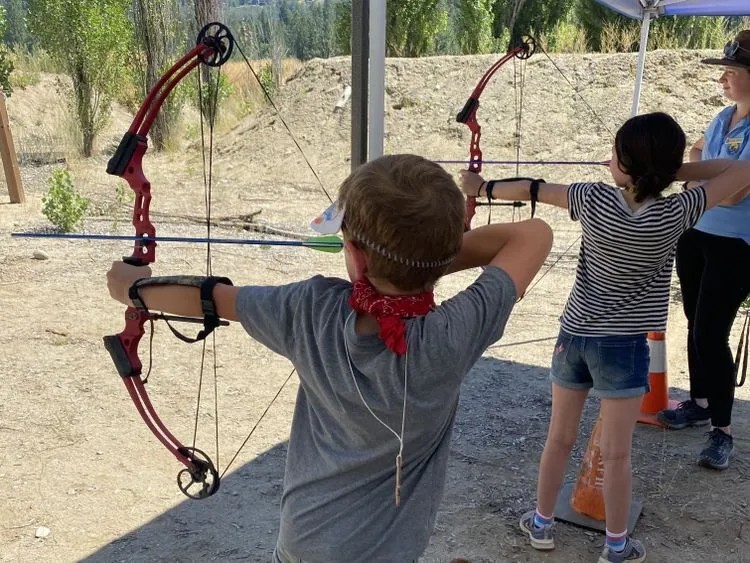 Kids at a WRI Summer Camp doing archery. 