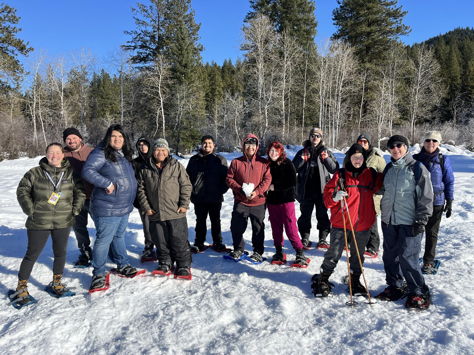A group picture of snowshoe tour participants from WRI Snowshoe Strolls.