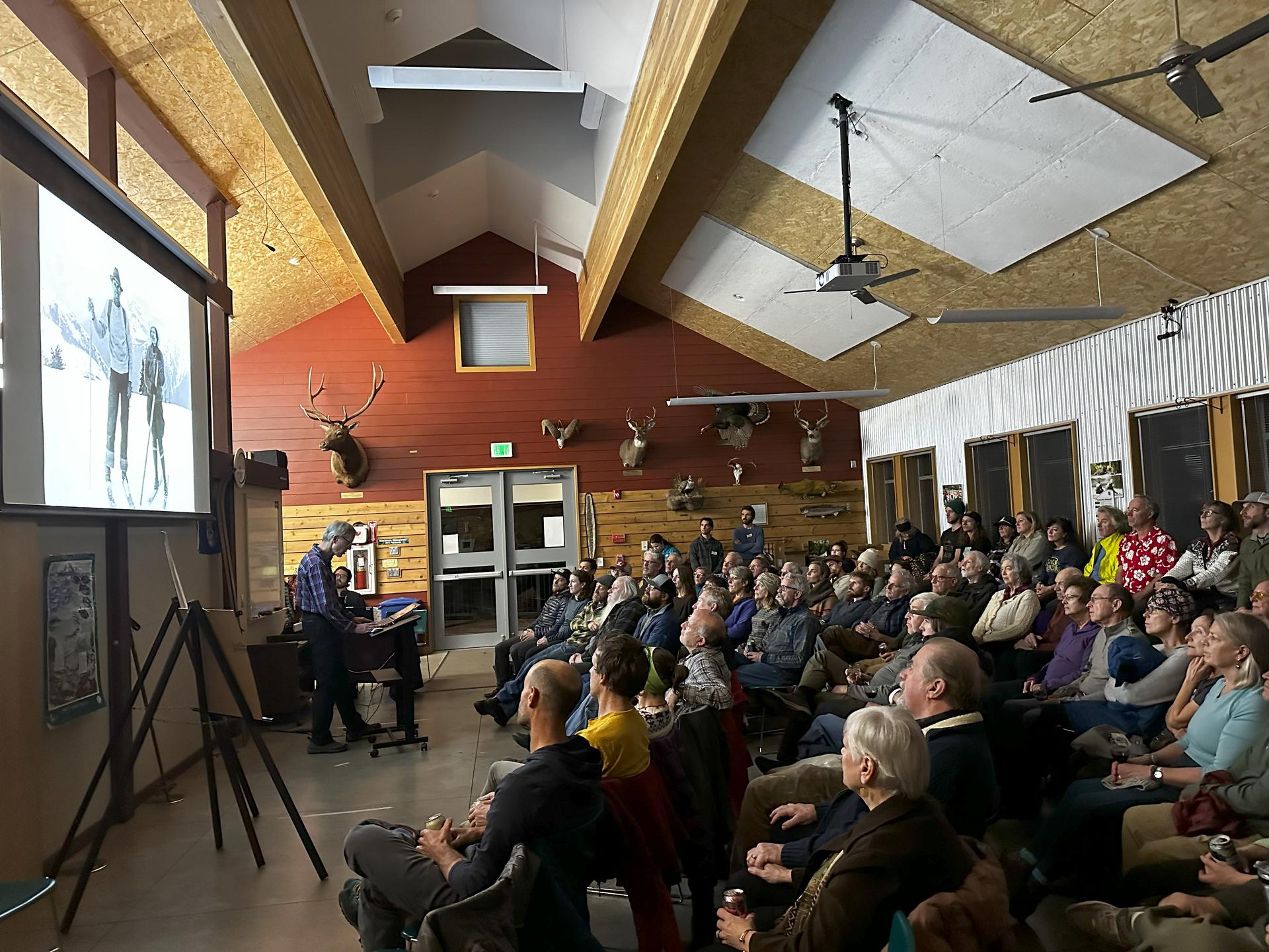An image from a WRI Red Barn Event with an audience engaged in the presentation.