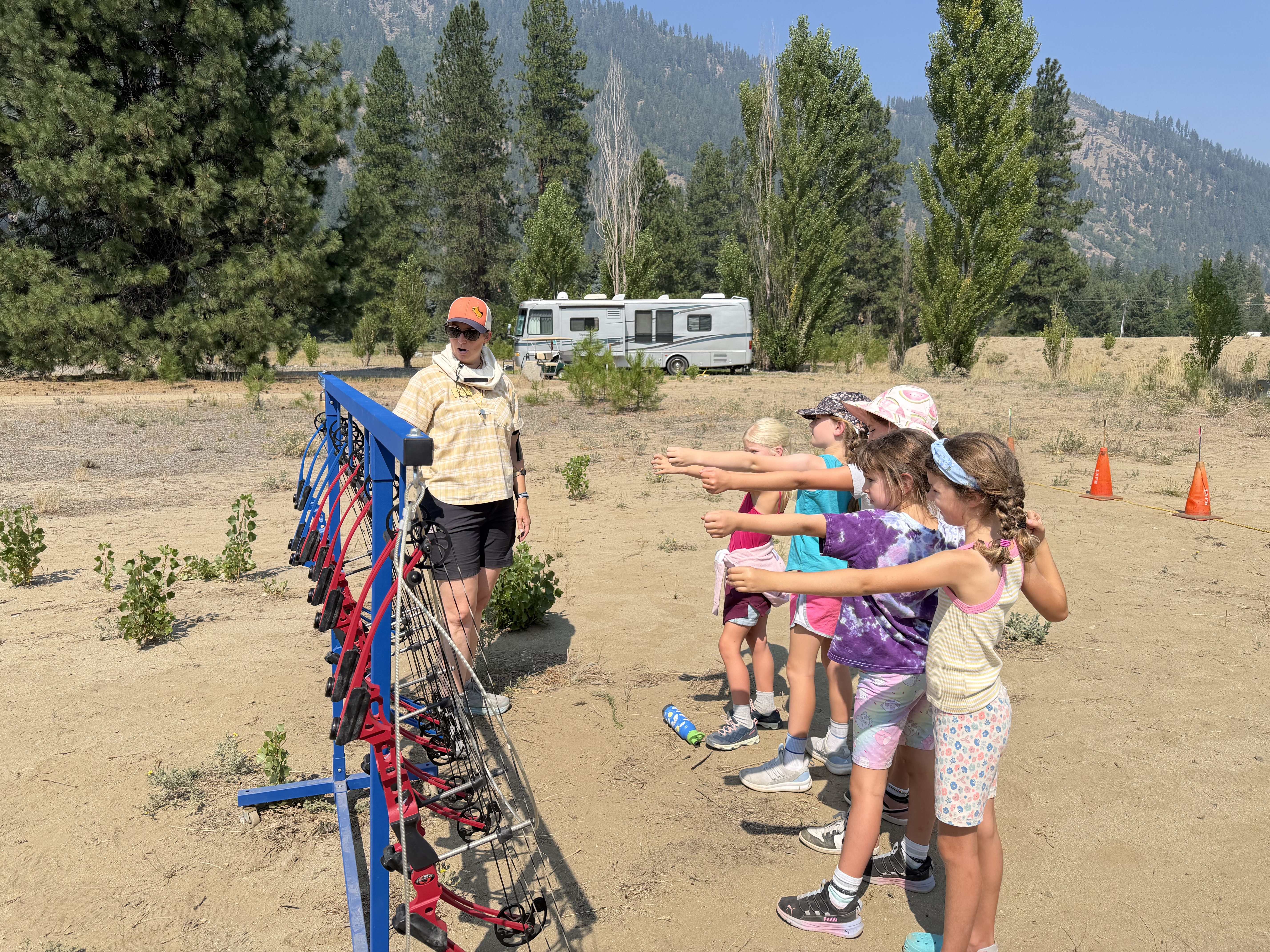 Kids in the Wild WRI Summer Camp with 1st-3rd graders at Leavenworth National Fish Hatchery learning archery.