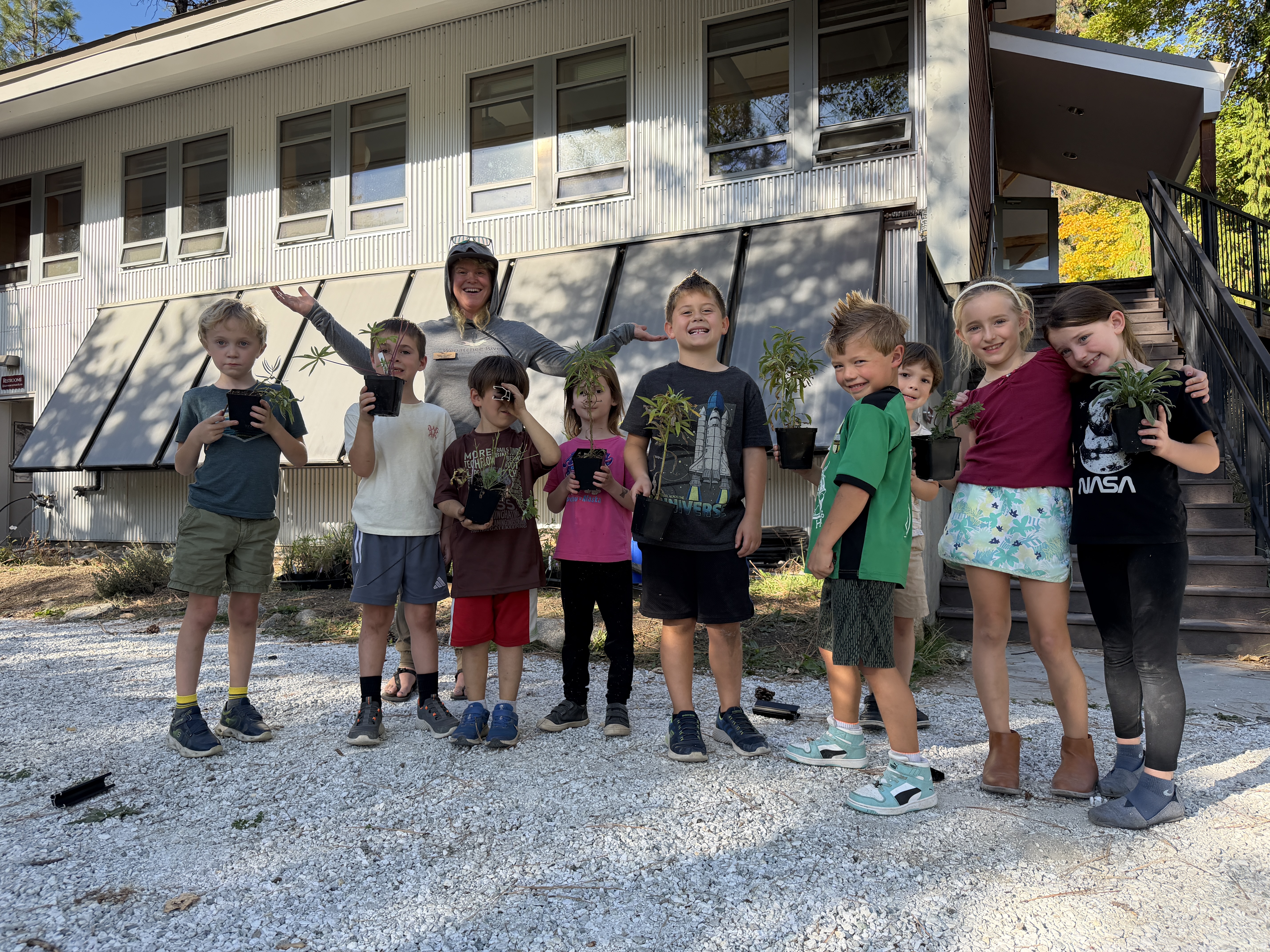 Kids from After School Programs helping plant native plants!