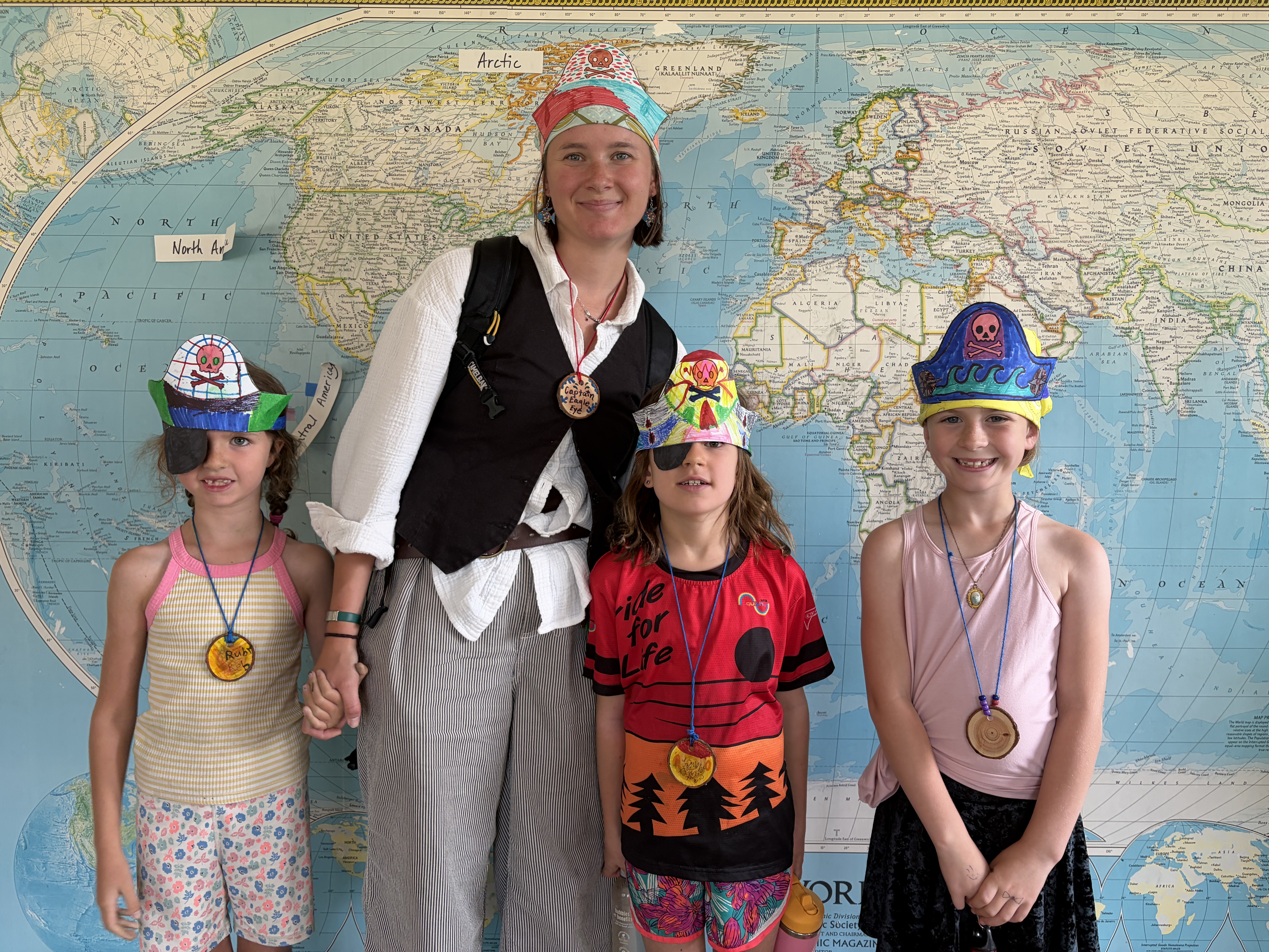 Emma posed with WRI Summer Camp Kids in the Wild dressed as pirates.