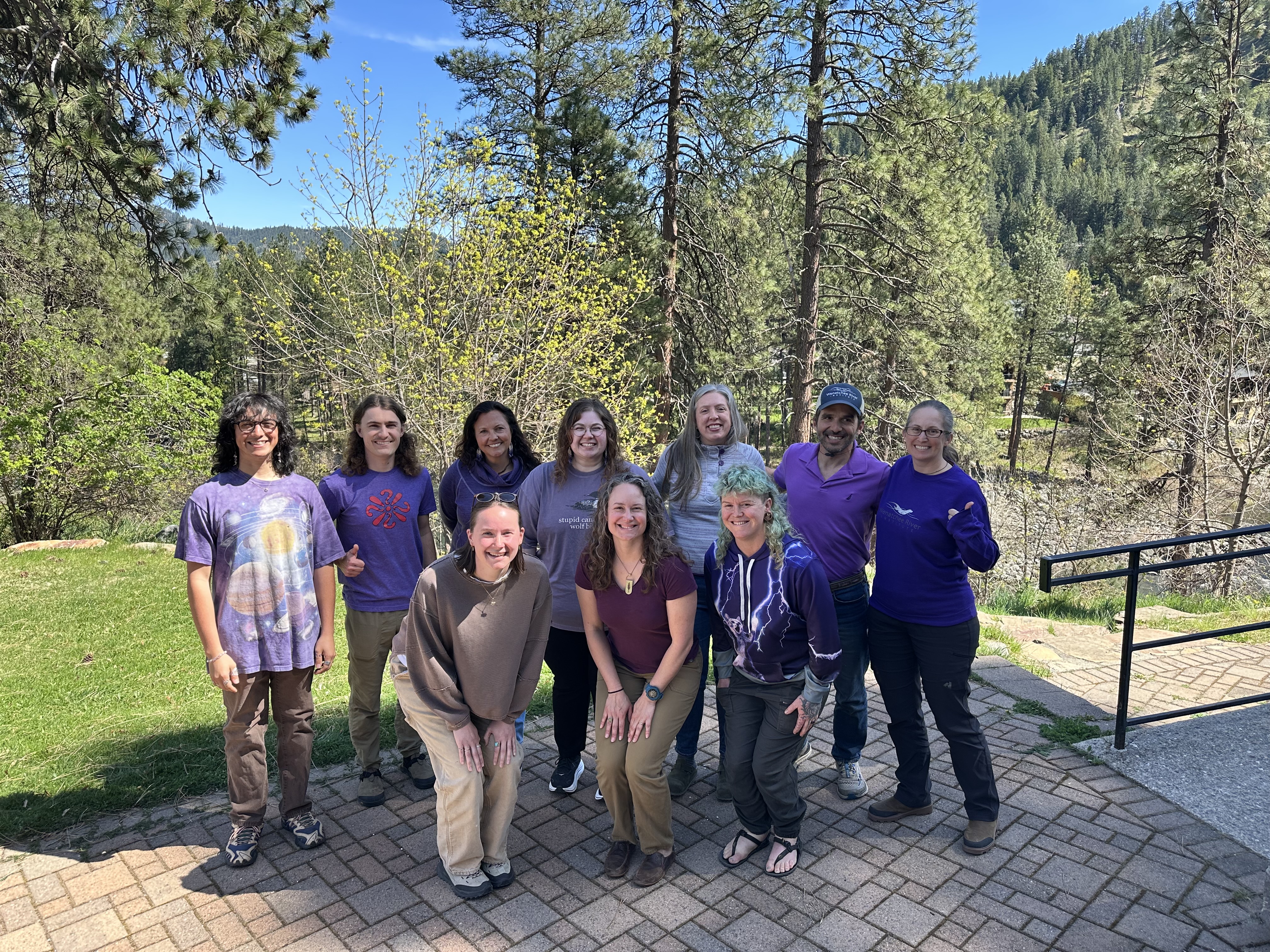 Image of WRI Staff posing in purple shirts to celebrate International Dark Sky Week.