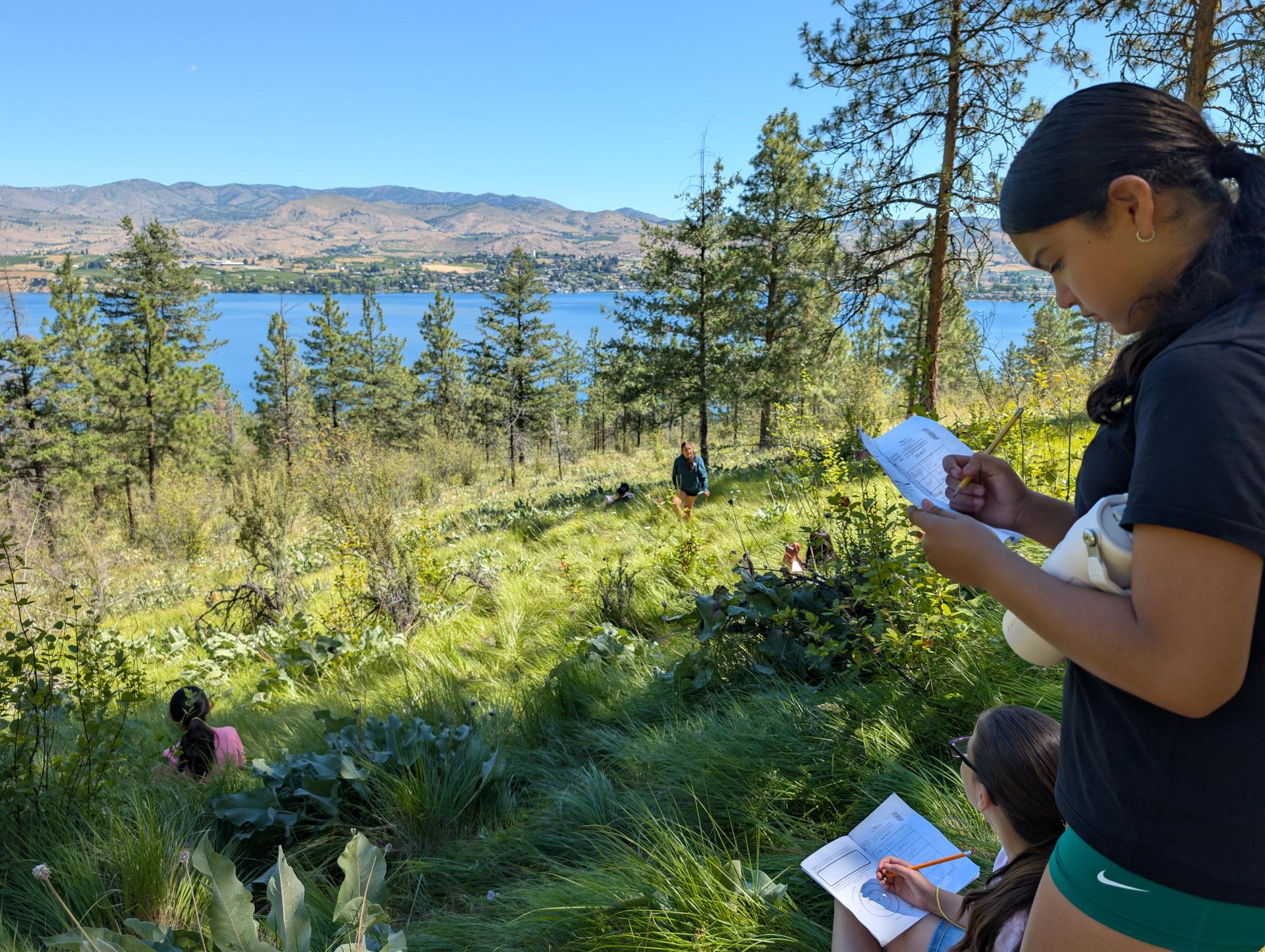 Students from Lincoln Elementary School in Wenatchee attending a WRI Summer Camp. They are journaling the nature they see around them.