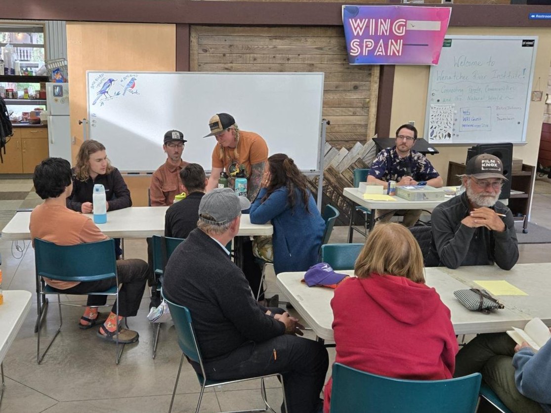 A picture of participants doing Wingspan game at WRI's Bird Fest 2025 in the Red Barn.
