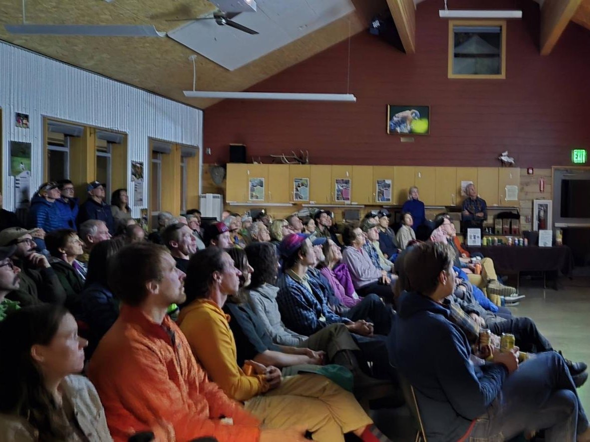 An image from Red Barn Event: Friends of Mission Ridge crowd watching the film screening.