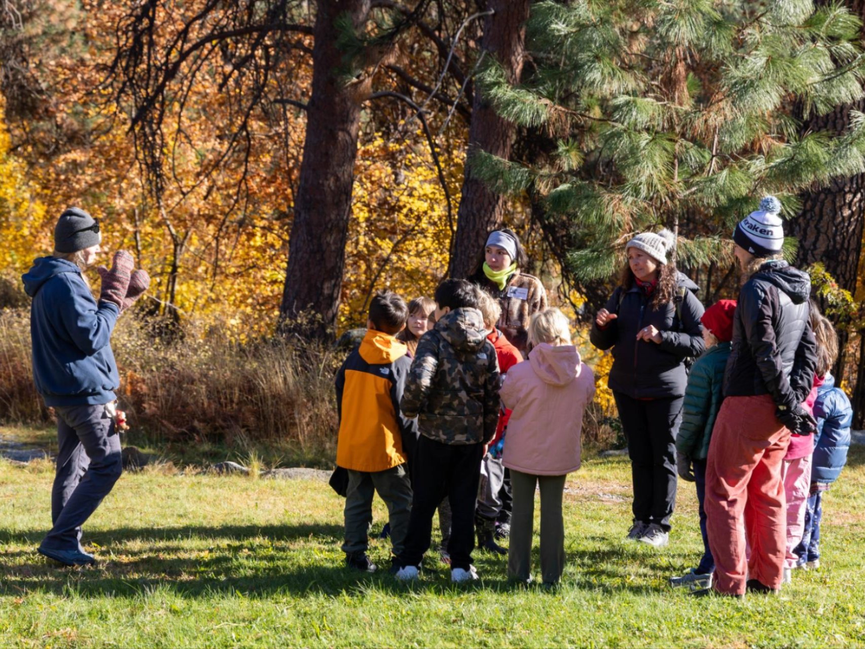 WRI Fall Field Day with kids listening to Educators.