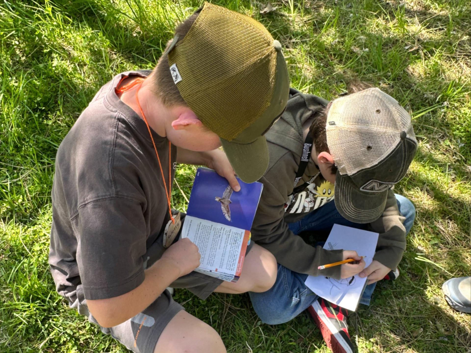 2 students doing Wild Birds Program during a WRI Field Day.