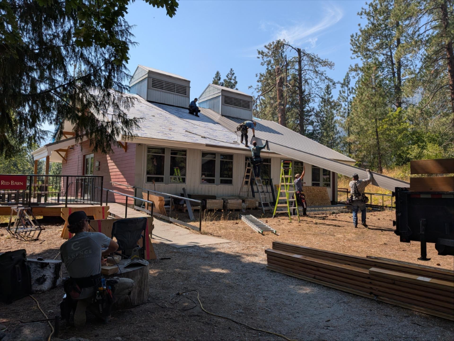 WRI Red Barn getting a new roof by construction crews. 