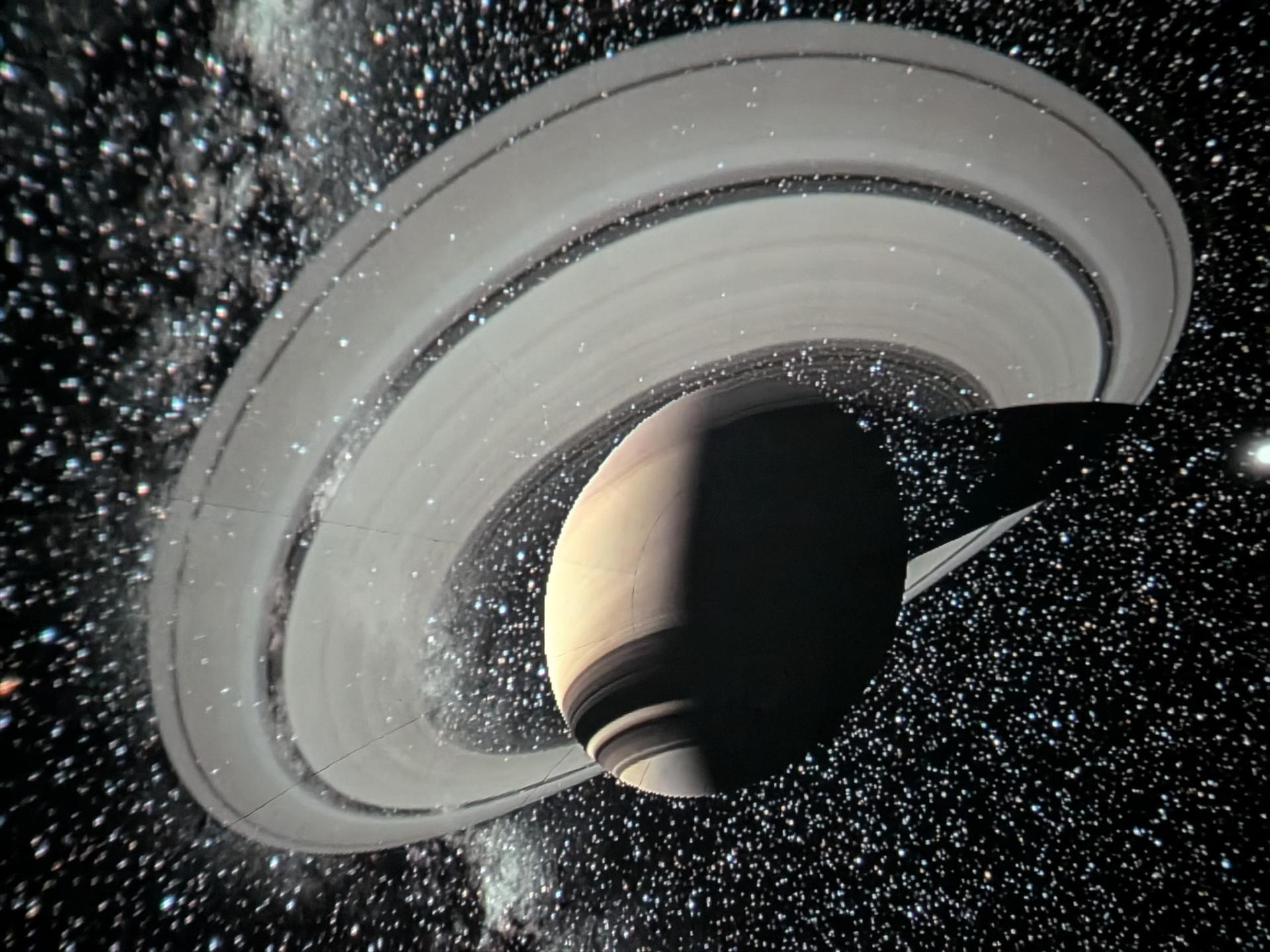 A graphic of a planet seen inside WRI's Traveling Planetarium