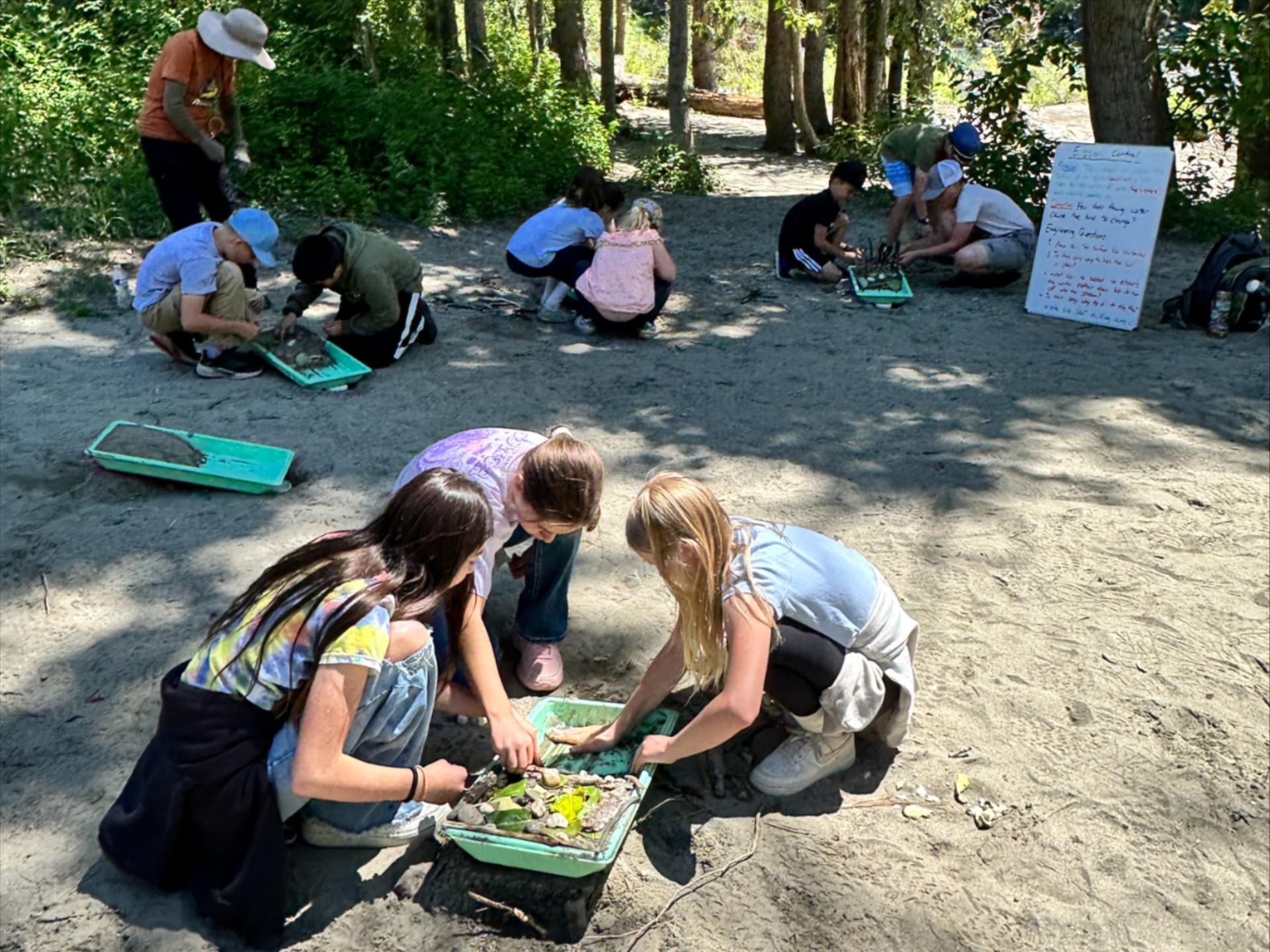 Students from Damman School that are learning about erosion with an activity at Barn Beach.