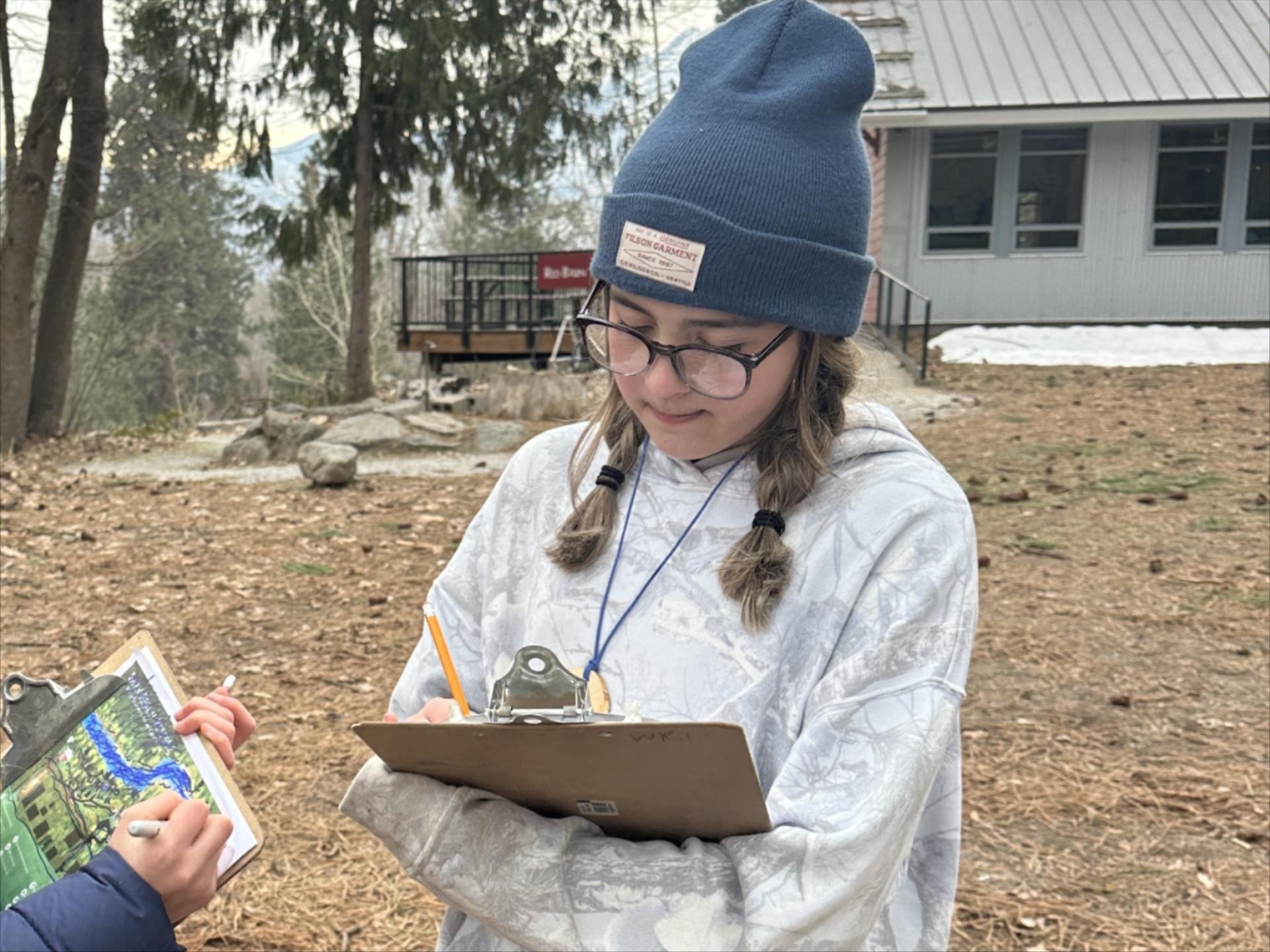 5th grade student taking notes during a WRI Earth Explorer lesson.
