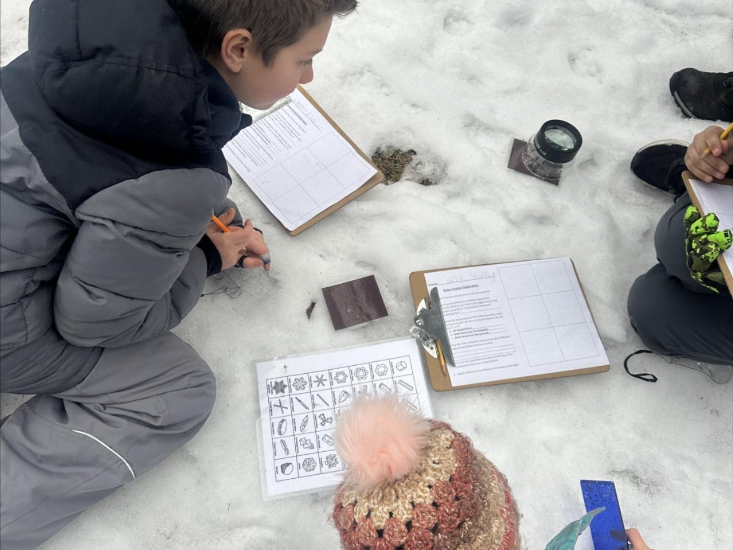 WRI Field Day kids doing an activity outside in snow.