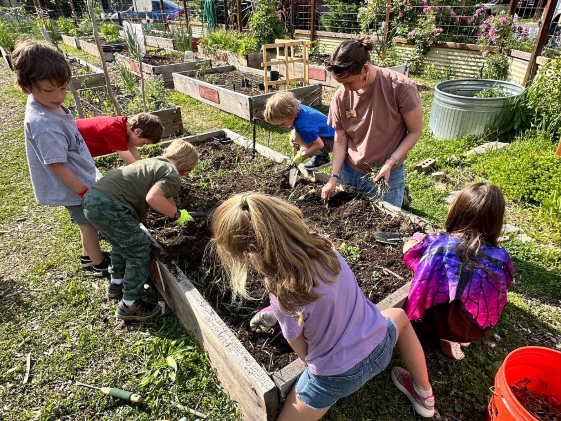 WRI After School Program kids planting their Community Garden plot.